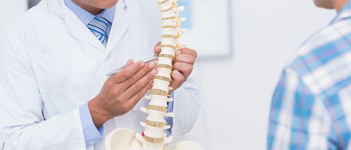 chiropractor explaining disc pain to patient